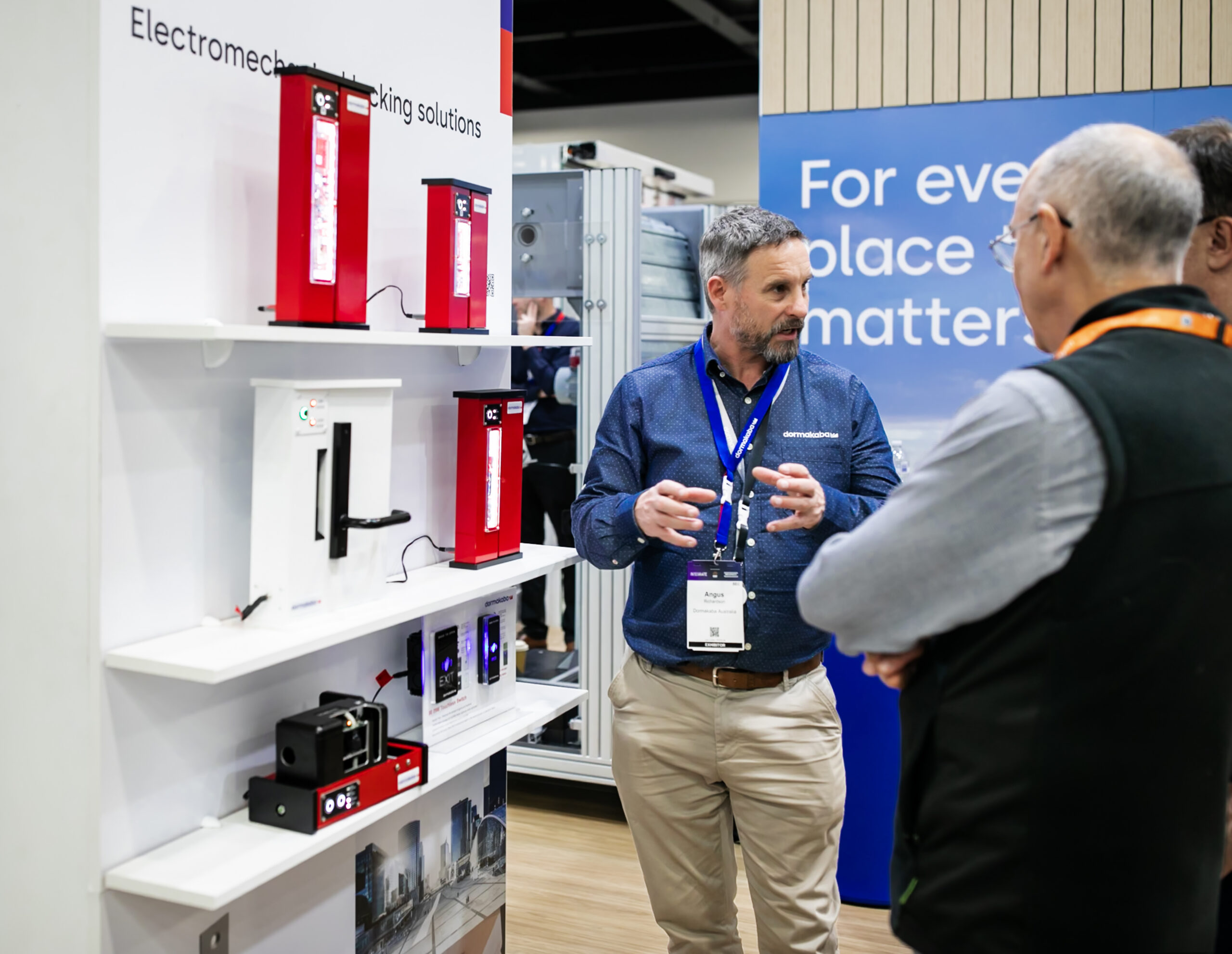Exhibitors demonstrating security technology on the show floor, 2025