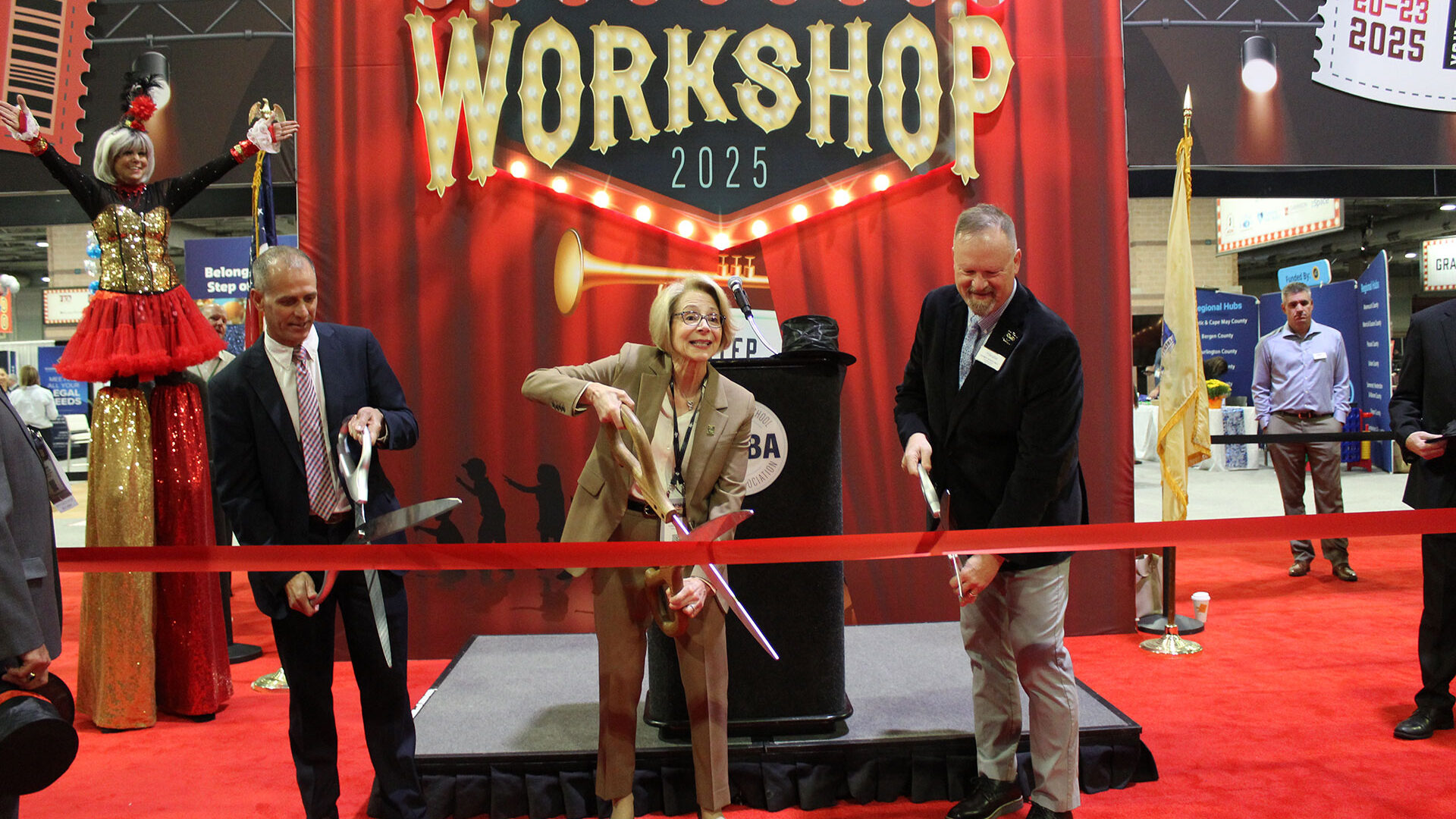 Workshop 2025 ribbon-cutting ceremony on the exhibit floor.